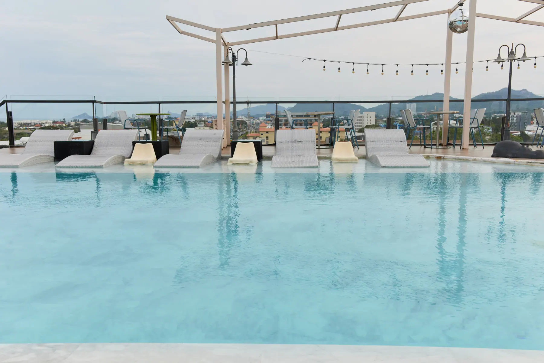 Rooftop pool and loungers above Hua Hin